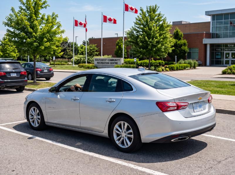 Student executing a perfect reverse parking maneuver in a driving school vehicle